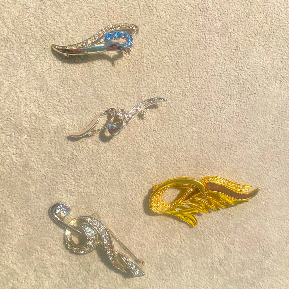 Brooches four for 20 only.